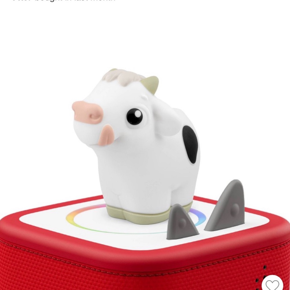 White and Black Cow Toy Figure